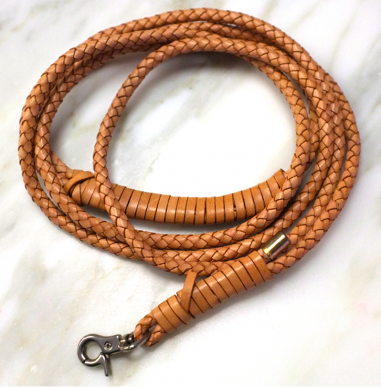 A braided rope that has a d link hook on the end of the rope.