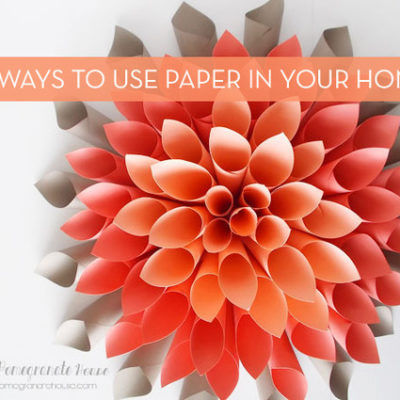 A pink paper craft flower up close.