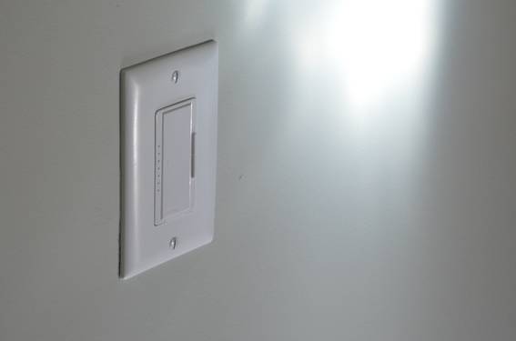 A light switch is visible on a white hallway.