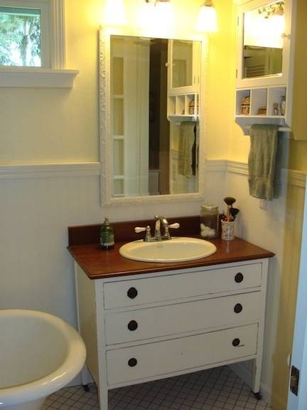 "A simple and Neatly Organized Bathroom with sinks and Tub"
