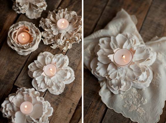 Flowery decorations used for a candle holder on a wooden surface.