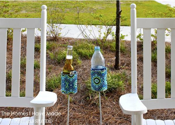Plastic bottles in cup holders by white wood rocking chairs.
