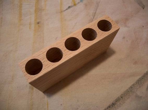 Test tube holder in wood.