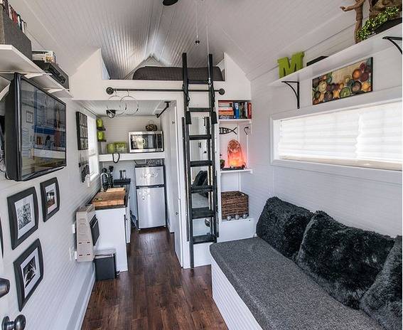 A ladder leading up to a loft in a tiny house.