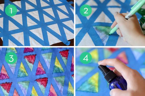 Masking tape in a triangular pattern with paint being applied.