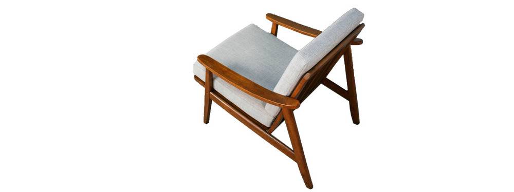 Wooden deck chair with fabric, cushioned pillows.