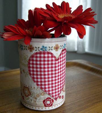 Flowers in a can with a fabric heart.