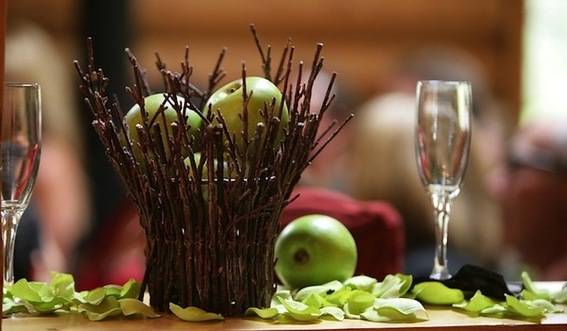 A table decorated with apple and few other items.
