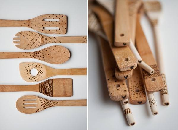 Wood kitchen utensils with engraved designs.