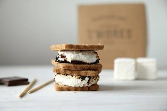 Double stack of s'mores with toasted marshmallows, graham crackers, and chocolate.