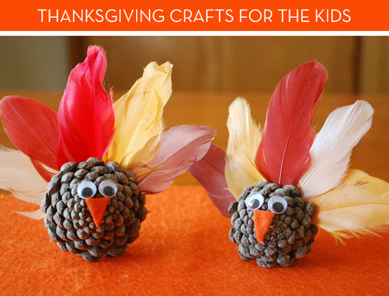 Small turkey decorations have been created out of pine cones, feathers, felt and googly eyes.