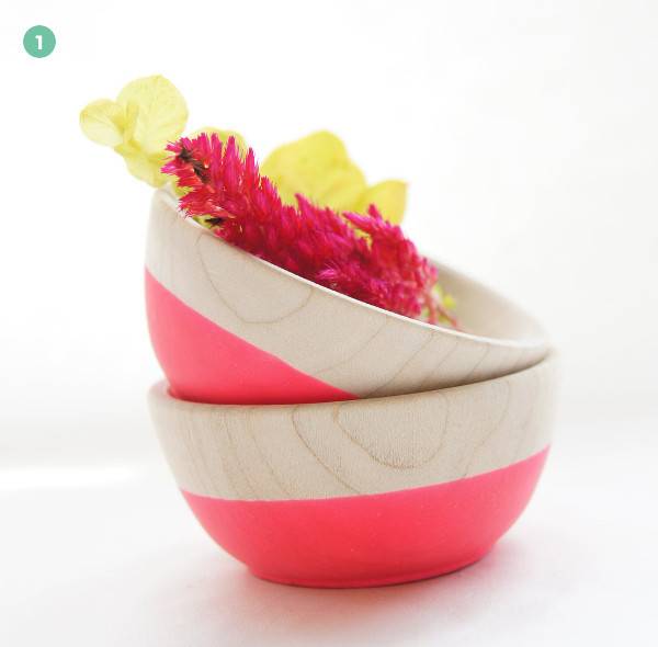 Flowers and ribbons inside a group of stacked bowls.