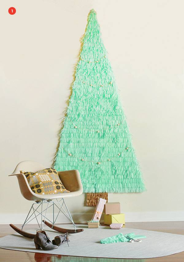 Handmade Christmas tree wall decor and granny chair on floor.