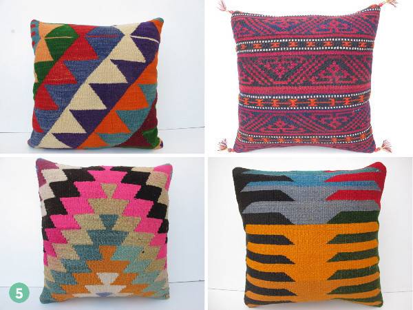 Four separate pillows with different colorful gemoetric designs.