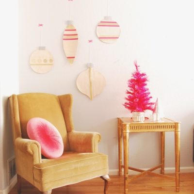 A chair and table with pink decorations around.