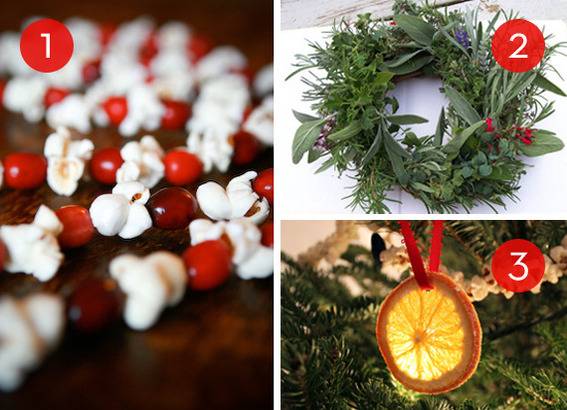 Food-themed Christmas decorations include a wreath made with herbs, hanging orange slices, and a cranberry and popcorn garland.