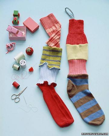 Christmas stockings made from multiple socks with sewing tools.