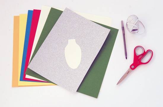 Many A-4 size papers of different colors are lying near a scissor, pen and a thread.
