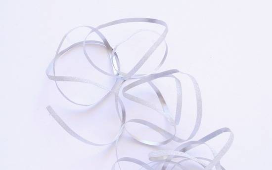 Ribbon is swirling around on a white background.