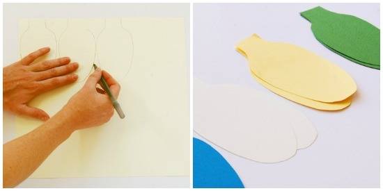 A person is drawing a light shape on the paper and placed the cut pieces of colorful light shape papers.