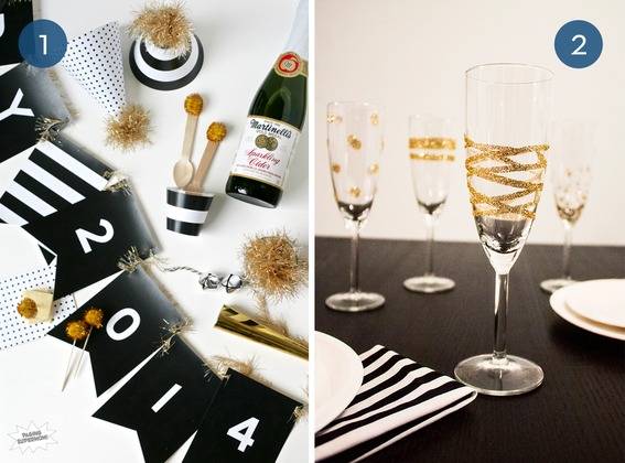 Black and white party favors including the year 2014 in White on black, and clear glasses with gold wrapped ribbon trim.