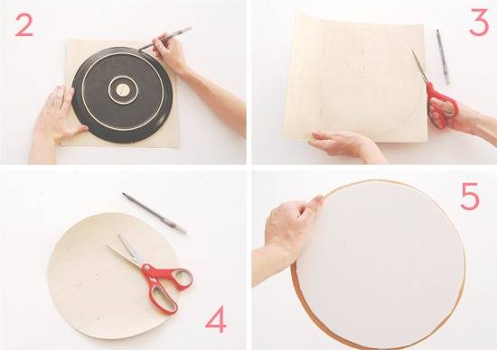 A round dish is used to trace a circle on a construction paper, which is then cut with a pair of red-handled scissors.
