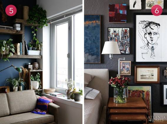 Living room with potted plants and photo frames on the wall.