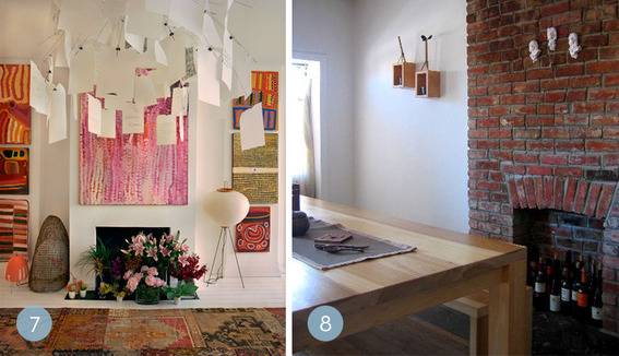 A room space decorated with papers, flowers and rug on the floor.