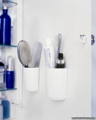 Shampoos and brush are in the bathroom.