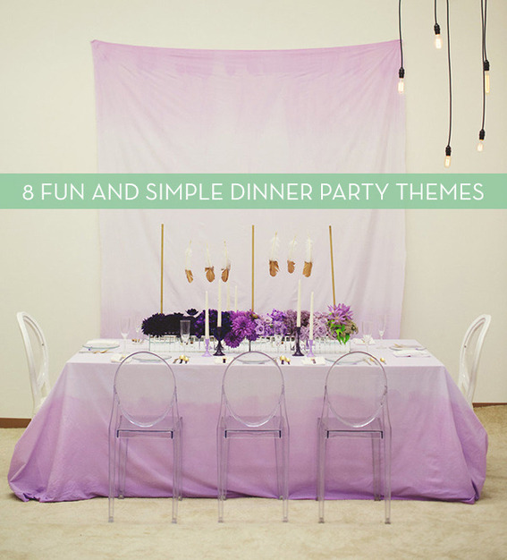 A purple and white table with chairs around it.