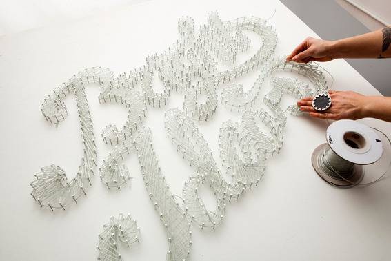 A person is explaining that how to make a neon typographic sign.