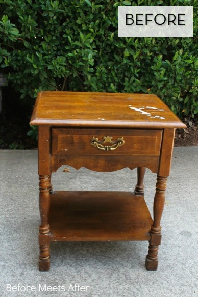 A wooden piece of furniture is sitting on the furniture outside.