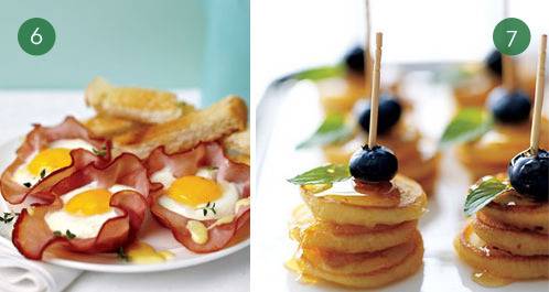Eggs cooked inside of rounds of Canadian bacon, and small pancakes stacked three on top of each other with the blueberries and a toothpick through them.