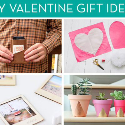 Polaroid photos, a man holding a wallet, a heart cut out of pink paper, and gold pyramids on pink terracotta flower pots.