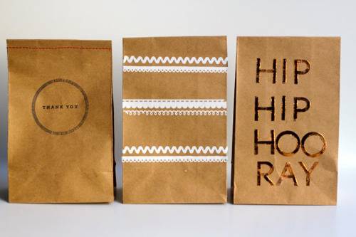 Three paper bags used for party favors.