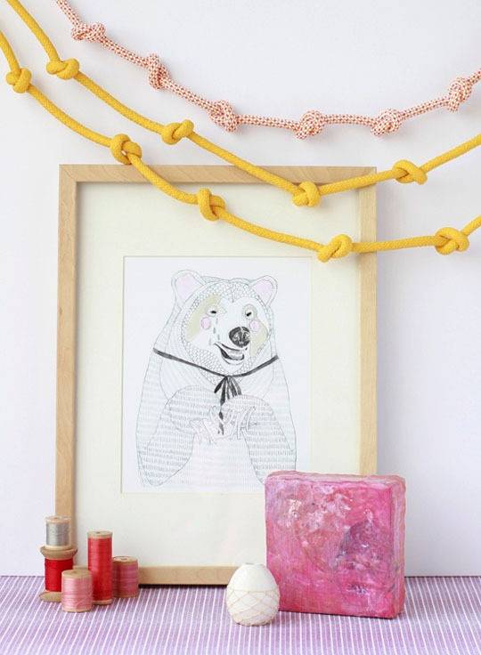 A drawing of a white bear with decorations surrounding it.