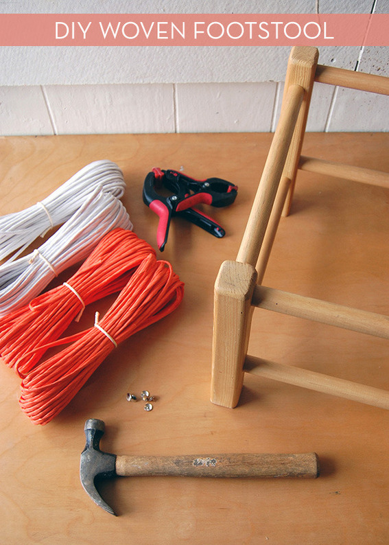 "Hammer,rope,tape and wooden stand to make woven footstool."