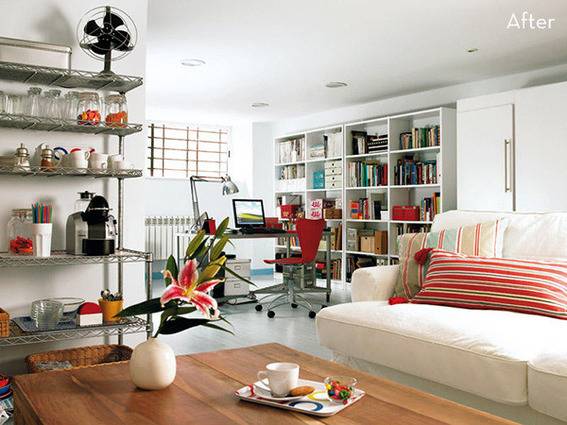 A colorful living room has lots of colorful items on shelves.