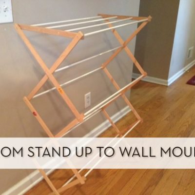 "Living room with standing and wall mounted drying rack."