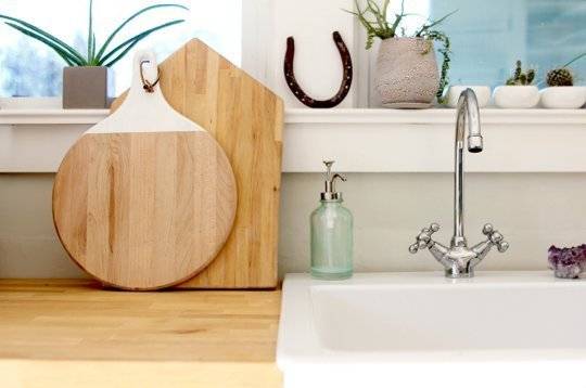 "Kichen appliance in organized way with tap and handwash."