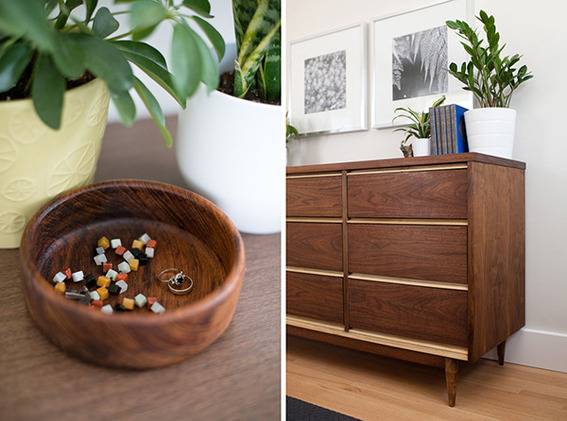 A brown dresser sits against a grey wall.