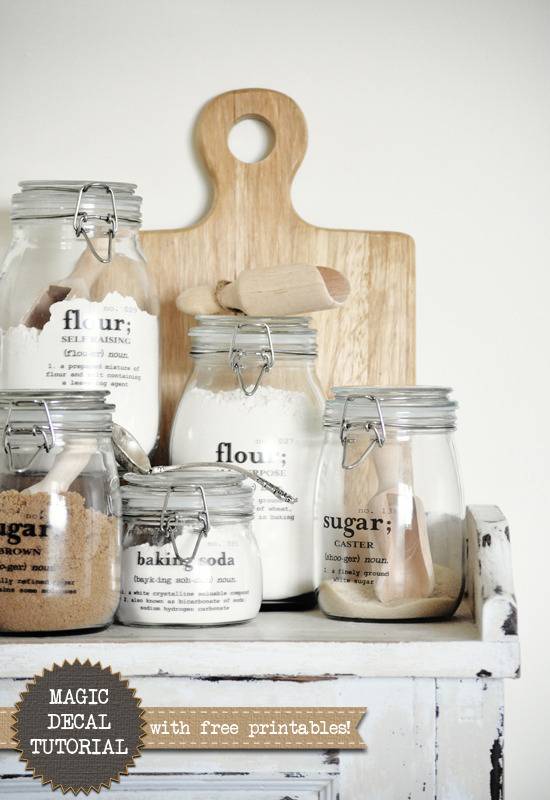 Several spices & sugars are in glass jars.