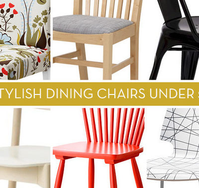 Several colorful dining room chairs are grouped together.