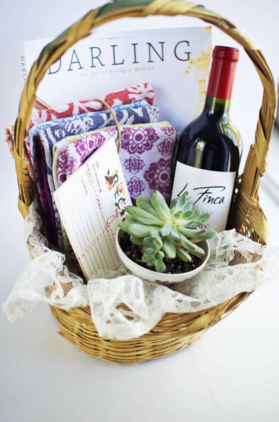 Wine and other items are arranged in a basket.