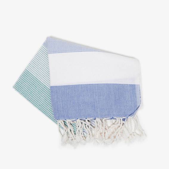 A blue and white scarf is folded over.
