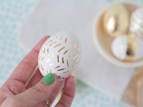 "Designer egg with golden stripes."