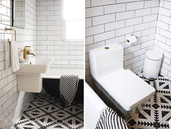 "Restroom with black and white tiles."