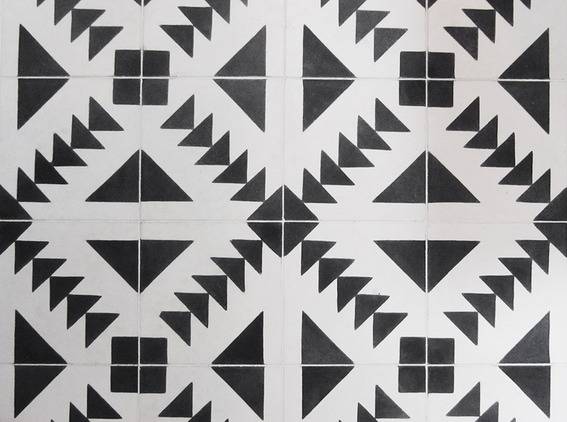 "Black and white designs in tiles."