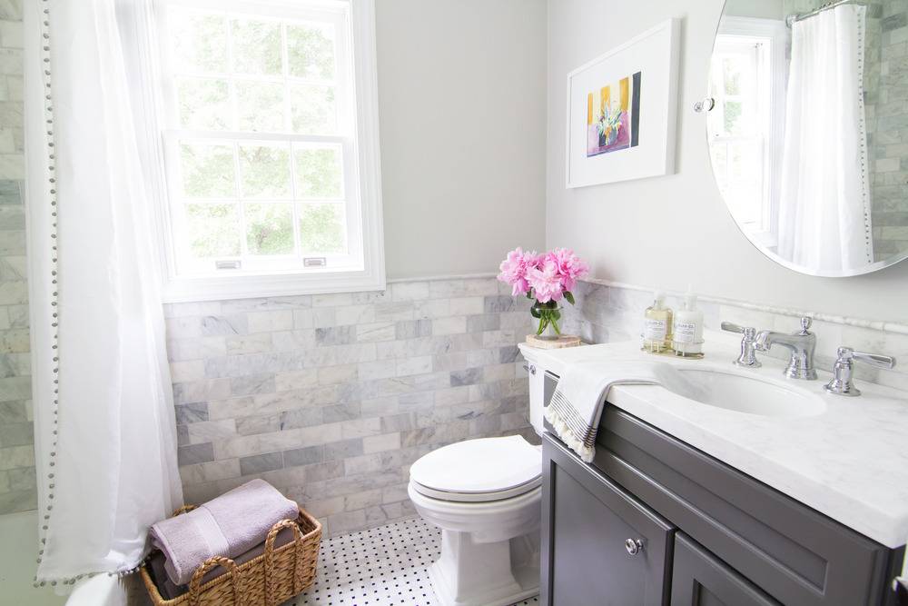 After - marble and chrome bathroom with grey vanity