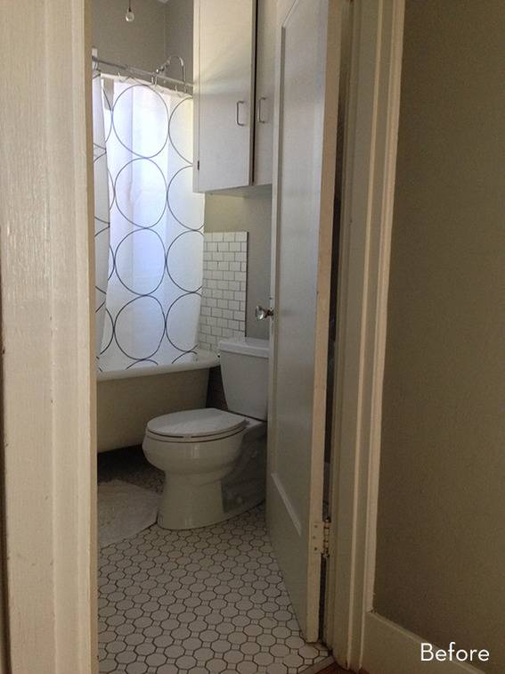 A light-colored bathroom with a toilet and shower.